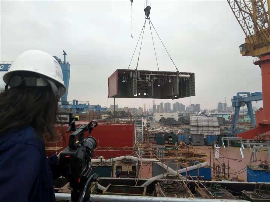 Foshan production crew reviewing a shoot on location