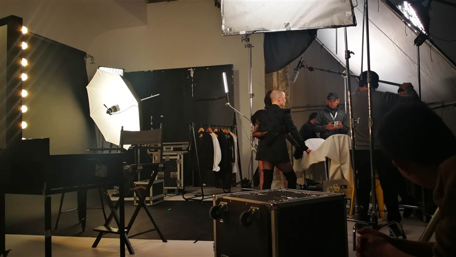 Foshan production team discussing a brief near a location setup